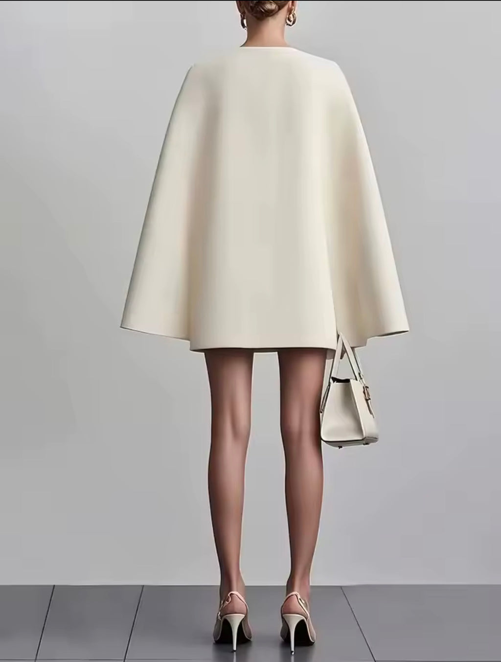 Abito da festa Elegante abito longuette con maniche a mantella