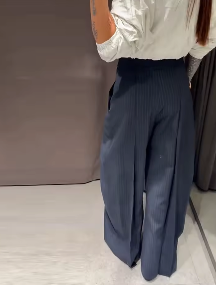 Pantaloni lunghi irregolari chic, larghi alla caviglia a vita alta